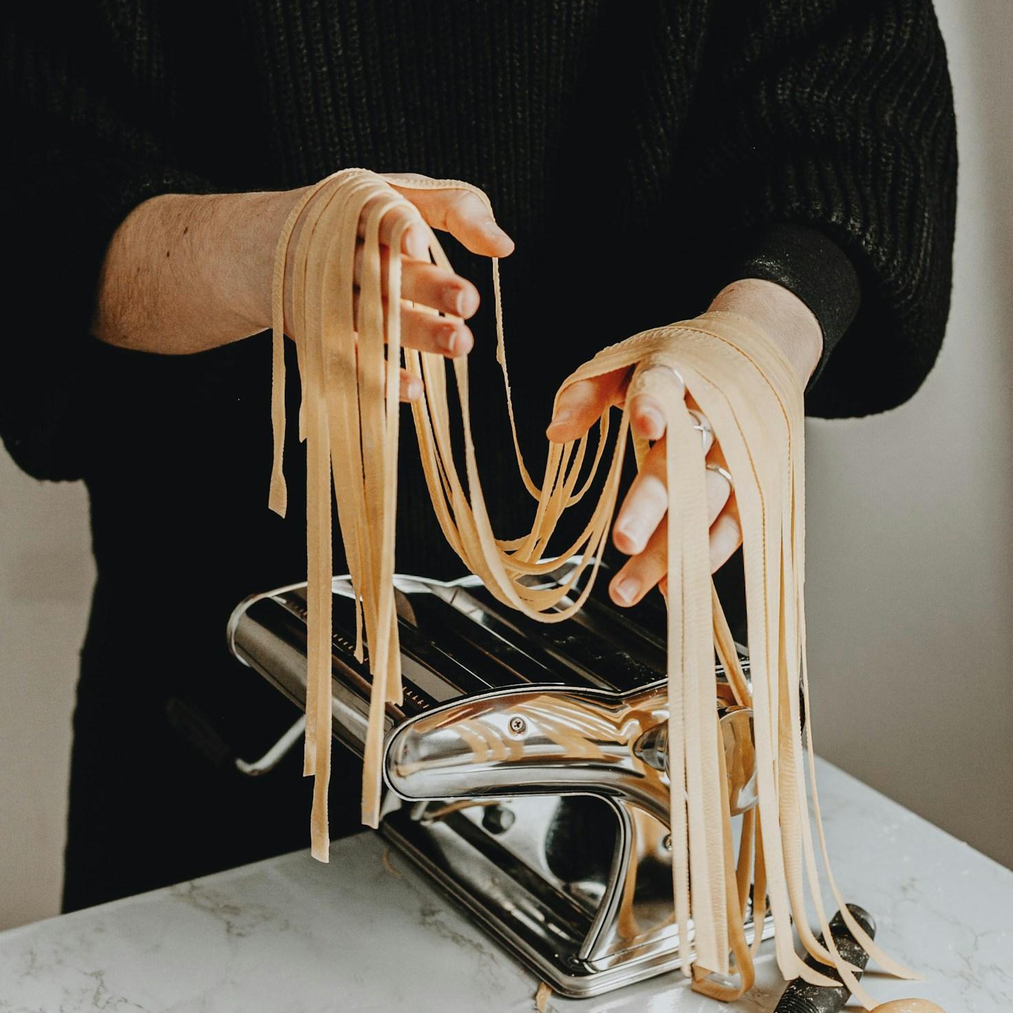 Community members collaborating in a modern kitchen space, sharing recipes and cooking techniques